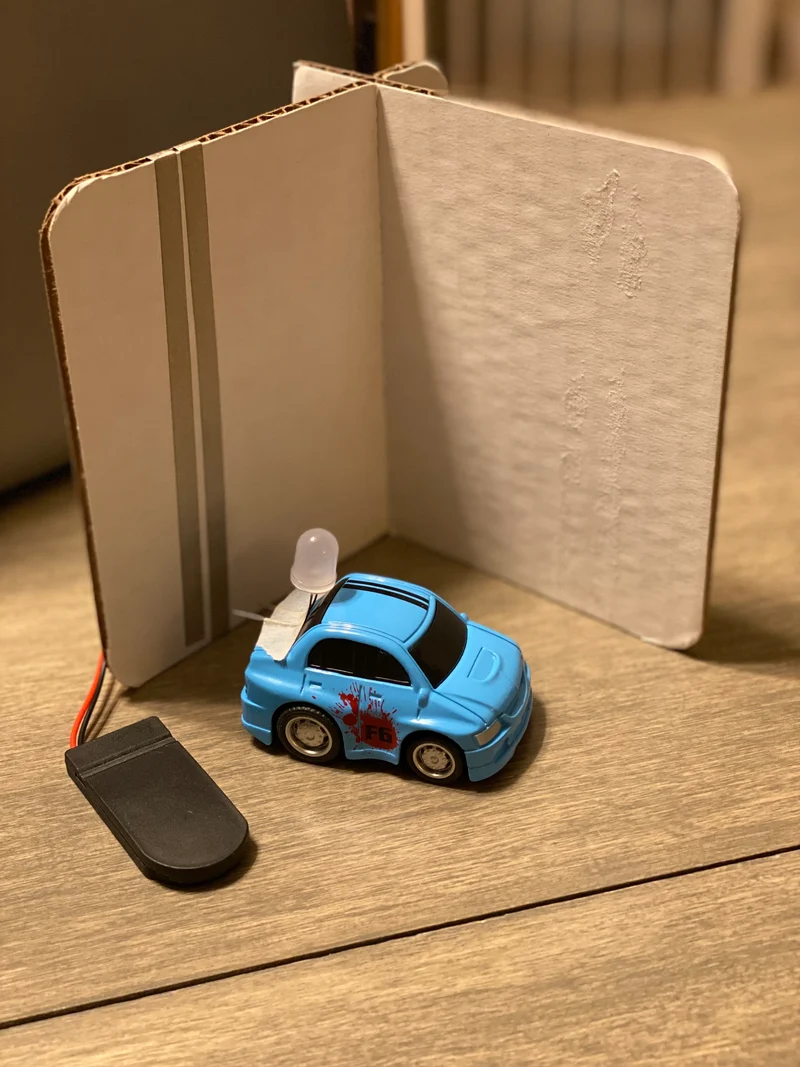 Model electric car with an LED from a classroom kit