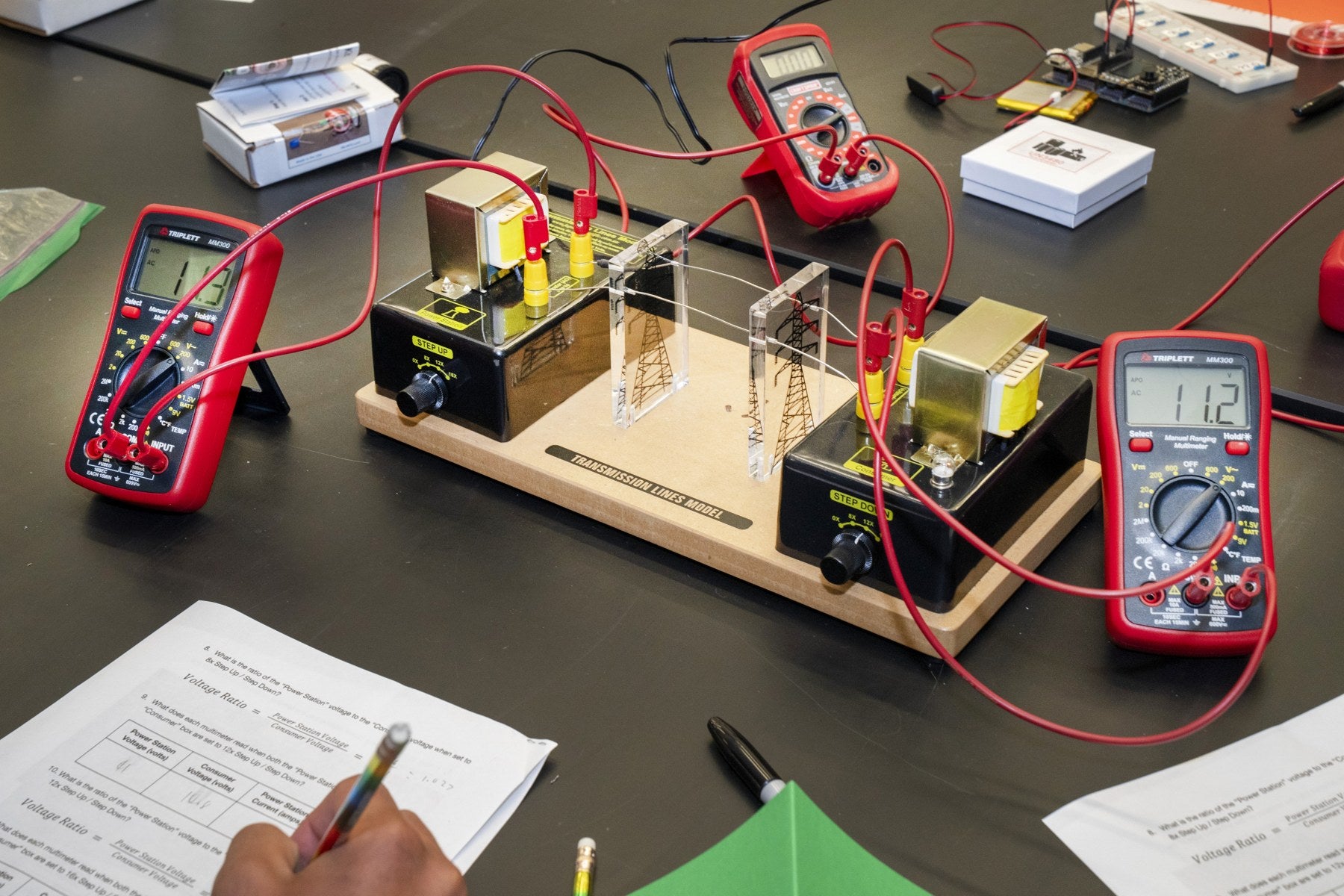 Transformer and multimeter activity on a lab bench