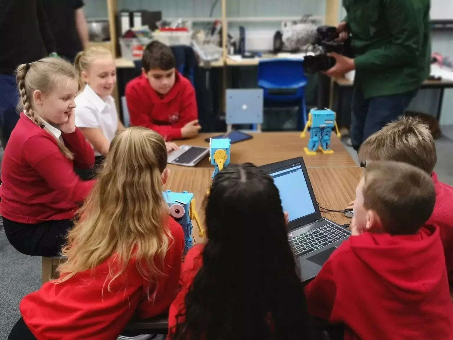 kids using marty the robot in classroom