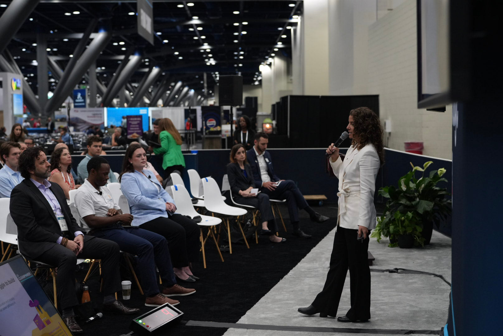 WhyMaker speaking to energy industry leaders at a clean power conference