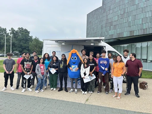 Internship students gathered outside with energy professionals